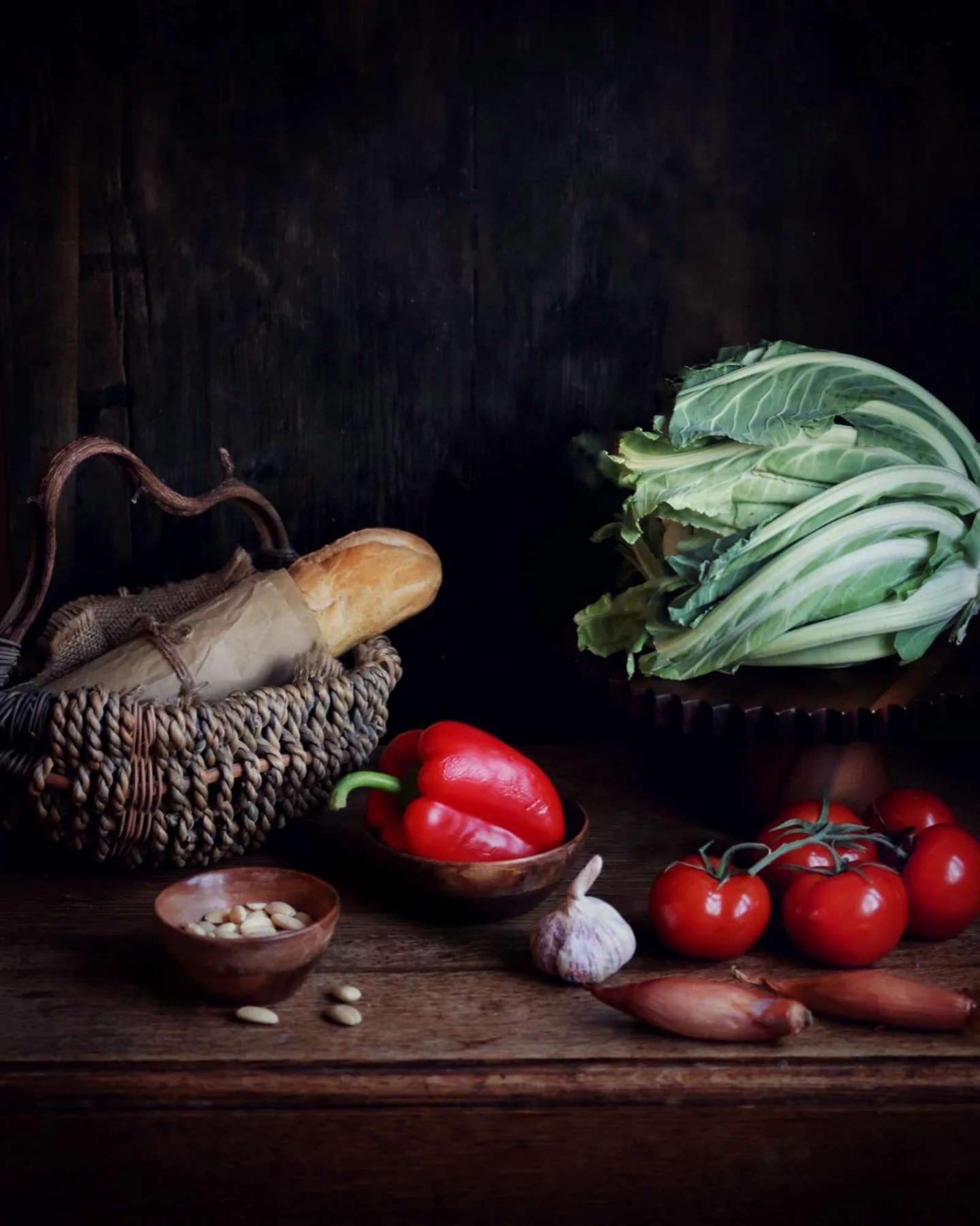 Close-up of seasonal vegetables and herbs on marble